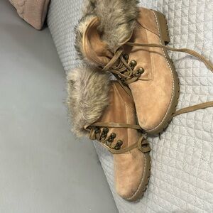 Adjustable boots with little marks but might come off with wash